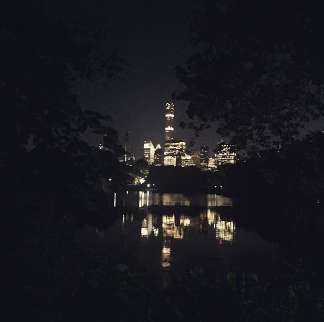 The city behind the trees. A little stroll in the park. #centralpark #natureinthecity #thebigapple #skyscrapers #reflection #water #night #darkness #light #contrast #beautiful #powerofnow #bepresent #takeapicture #lookaround #nyc #newyork #newyorknewyork